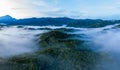 Aerial image of beautiful fresh green nature landscape scene of tropical rainforest and clouds during morning sunrise Royalty Free Stock Photo