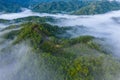 Aerial image of beautiful fresh green nature landscape scene of tropical rainforest and clouds during morning sunrise Royalty Free Stock Photo