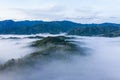 Aerial image of beautiful fresh green nature landscape scene of tropical rainforest and clouds during morning sunrise Royalty Free Stock Photo