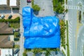 Aerial image building tented blue for fumigation