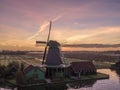 Aerial of classic dutch windmills at the Zaanse Schans during a stunning sunrise Royalty Free Stock Photo