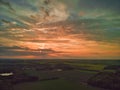 Aerial view of a dramatic sunset over open farmland in the English countryside Royalty Free Stock Photo