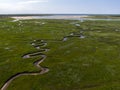 Aerial image of dutch national park the slufter with curving rivers in grass land towards the north sea on the island of Texel Royalty Free Stock Photo