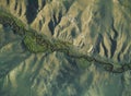 Aerial Image of a river flowing through a valley surrounded by cliffs