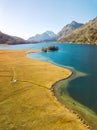 Aerial image of Insola, Maloja in autumn color on the lake of Silsersee, St. Moritz Royalty Free Stock Photo