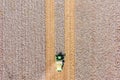 Aerial image of a Large Cotton picker harvesting a field.