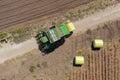 Aerial image of a Large Cotton picker harvesting a field.