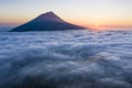 Aerial image with magical sunset over a low cloud layer covering Pico Island, with Ponta do Pico Mount Pico, the highest Royalty Free Stock Photo