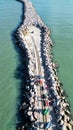 Aerial image of sailing wagons moving on rails at the end of the breakwater 4km into the ocean on a sunny day at a beach in Royalty Free Stock Photo