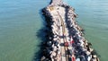 Aerial image of sailing wagons moving on rails at the end of the breakwater 4km. Royalty Free Stock Photo