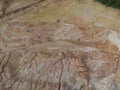 aerial scene of the land erosion due to deforestation and earth mining.