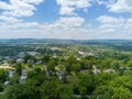 Aerial image showcases a picturesque town, with a vibrant, lush green landscape