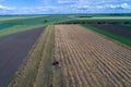 Aerial image of tractor with hay tedders