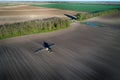 Tractor spraying soil in field Royalty Free Stock Photo