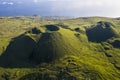 Aerial image of typical green volcanic caldera crater landscape with volcano cones of Planalto da Achada central plateau of Ilha Royalty Free Stock Photo