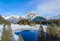 Aerial image of the winter landscape of the frozen Arni Lake with the snow-convered Alps peak Windgaellen Royalty Free Stock Photo