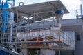 Aerial image of a woodworking plant with piles of logs around.