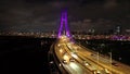 Aerial 4k video of Xinbei bridge at night. Cars passing through the bridge with colorful lights.