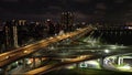 Aerial 4k video of Xinbei bridge at night. Cars passing through the bridge with colorful lights.