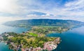 Aerial: lake Toba and Samosir Island view from above Sumatra Indonesia. Huge volcanic caldera covered by water, traditional Batak