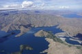 Aerial lake view of Canterbury landscape through perspex canopy from within glider cockpit in flight