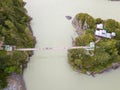 Aerial of a landmark in the Altai Territory Patmos Island with a monastery church and a suspended wooden bridge Royalty Free Stock Photo