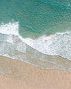 Aerial landscape of a beach at sunrise with stunning blue water