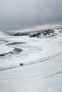 Aerial landscape with a car on the winter road