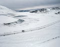 Aerial landscape with a car on the winter road