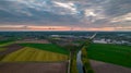 Aerial landscape of countryside with colorful storm clouds. Extreme thunderstorm over a farm and agricultural fields and Royalty Free Stock Photo