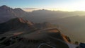 Aerial landscape on the Dolomites, Itlay: Seceda in autumn, with people flying paragliding in the monring