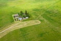 Aerial landscape with farm house, equipment and warehouses among green fields Royalty Free Stock Photo