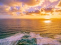 Aerial landscape of golden sunset over ocean Royalty Free Stock Photo