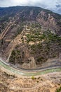 Aerial landscape of a highway road in the mountains in the Mangkang, in a vertical shot Royalty Free Stock Photo