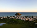 Aerial landscape photo of Recreio dos Bandeirantes beach during sunset, with views of Chico Mendes park and the Pontal