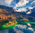 Aerial landscape photography. Fantastic autumn view from flying drone of Eibsee lake with Zugspitze mountain range on background Royalty Free Stock Photo