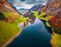 Fantastic autumn view from flying drone of Seealpsee lake. Royalty Free Stock Photo