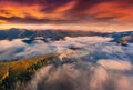 Aerial landscape photography. Sea of fog covered mountain valley. Royalty Free Stock Photo