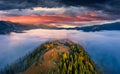 Aerial landscape photography. Sea of fog covered mountain valleys and hills Royalty Free Stock Photo