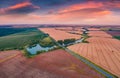 Aerial landscape photography. Spectacular summer sunset on the Ternopil outskirts with two lakes and asphalt road Royalty Free Stock Photo