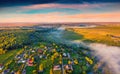 Aerial landscape photography. Stunning summer view from flying drone of Ukrainian countryside with foggy river. Royalty Free Stock Photo