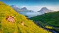 Aerial landscape photography. Sunny July day on Faroe Islands. Captivating summer view of Tindholmur cliffs.