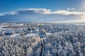 Aerial landscape of the road through snowy forest at winter, Poland Royalty Free Stock Photo