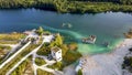 Aerial landscape Sand Hills of Quarry With a Pond and Abandoned Prison in Rummu Estonia Europe.