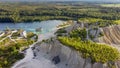 Aerial landscape Sand Hills of Quarry With a Pond and Abandoned Prison in Rummu Estonia Europe.