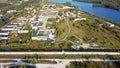 Aerial landscape Sand Hills of Quarry With a Pond and Abandoned Prison in Rummu Estonia Europe.