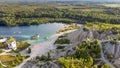 Aerial landscape Sand Hills of Quarry With a Pond and Abandoned Prison in Rummu Estonia Europe.