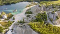 Aerial landscape Sand Hills of Quarry With a Pond and Abandoned Prison in Rummu Estonia Europe.