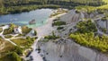 Aerial landscape Sand Hills of Quarry With a Pond and Abandoned Prison in Rummu Estonia Europe.