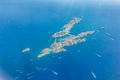 Aerial landscape of small island with sailboats and speedboats close to coast of French Riviera Royalty Free Stock Photo